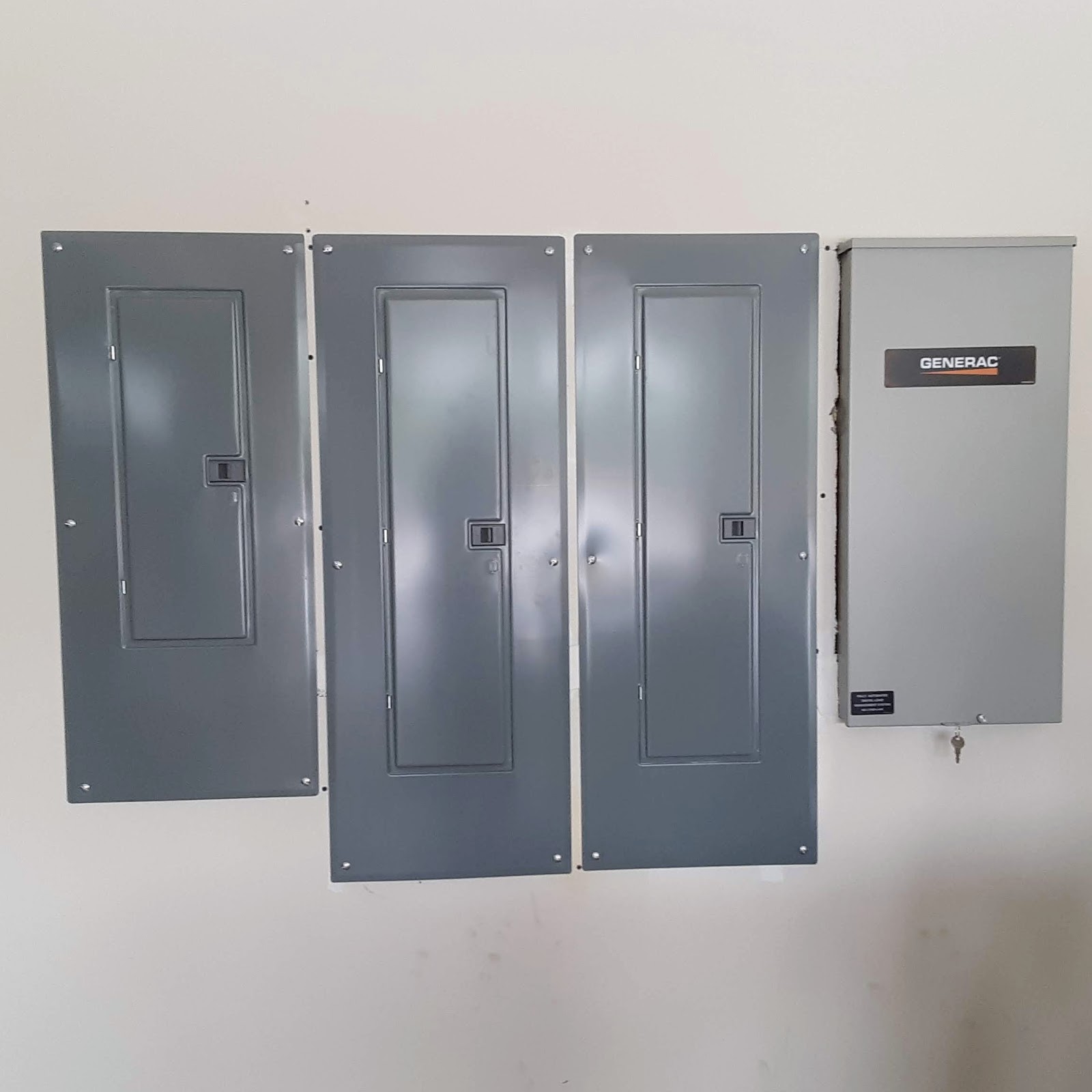 S&W Electric bank of three breaker panels with Generac automatic transfer switch